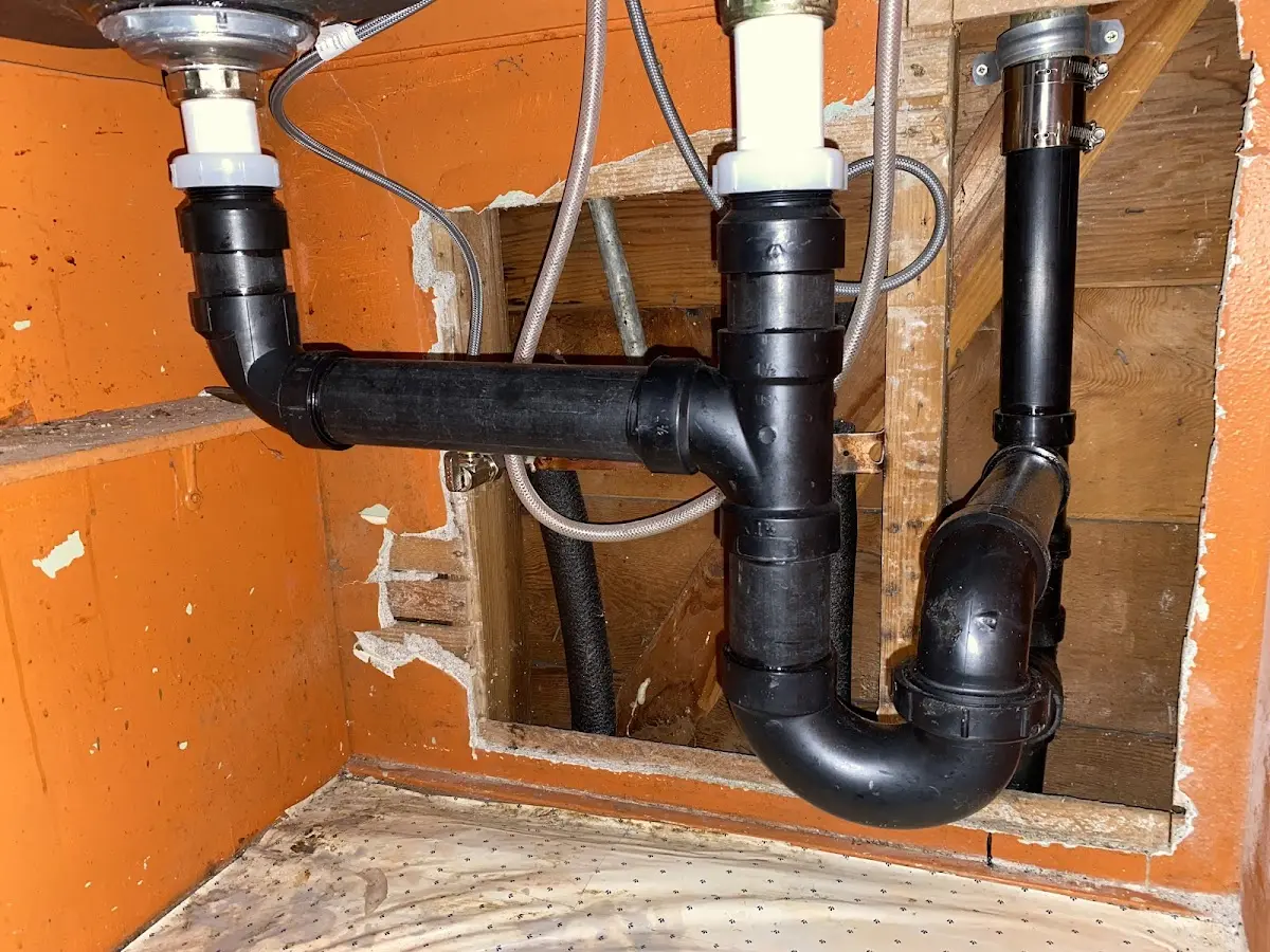 Professional Garbage Disposal Repair equipment and tools on the job in Ada